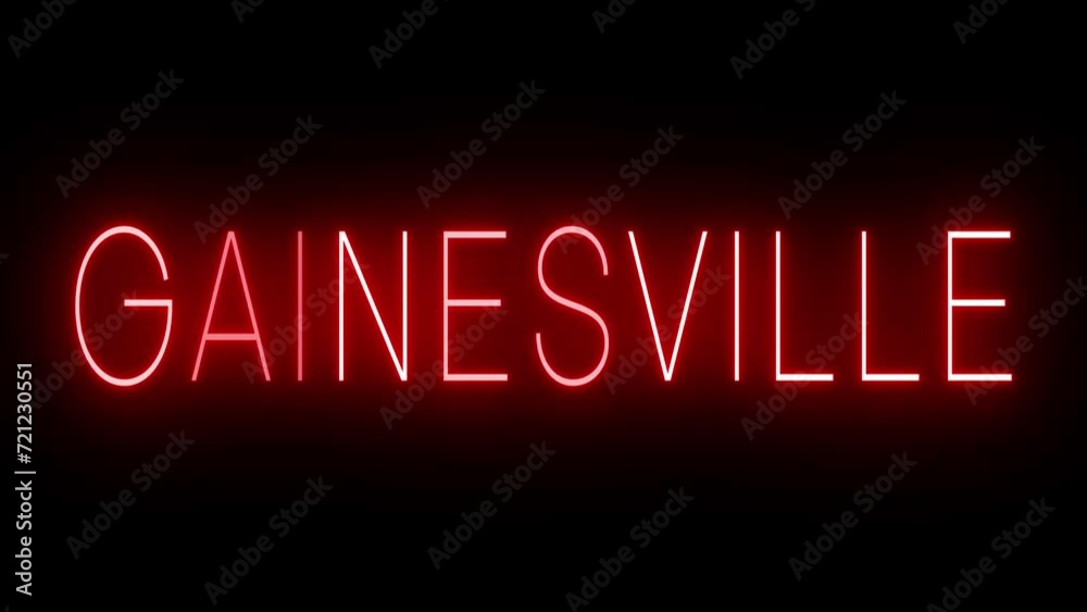 Flickering red retro style neon sign glowing against a black background