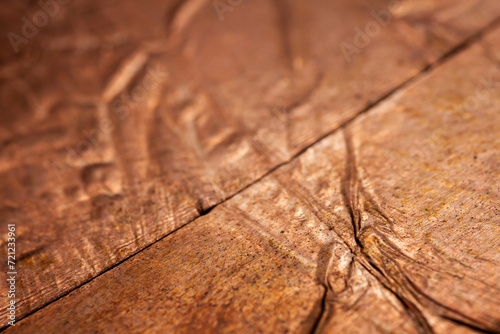 Extreme closeup of crumpled brass foil texture © Taigi