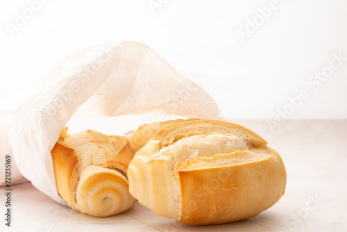 Fresh baked flour bread in clean white background in front view photo with copy blank space