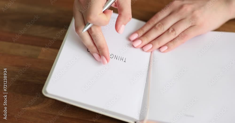 Woman open diary and write down affairs. Future planning goal and motivation Woman open diary and write down affairs. Future planning goal and motivation
