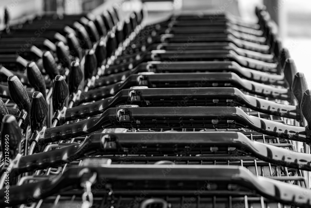 stacked shopping trolleys in selective focus stacked shopping trolleys in selective focus