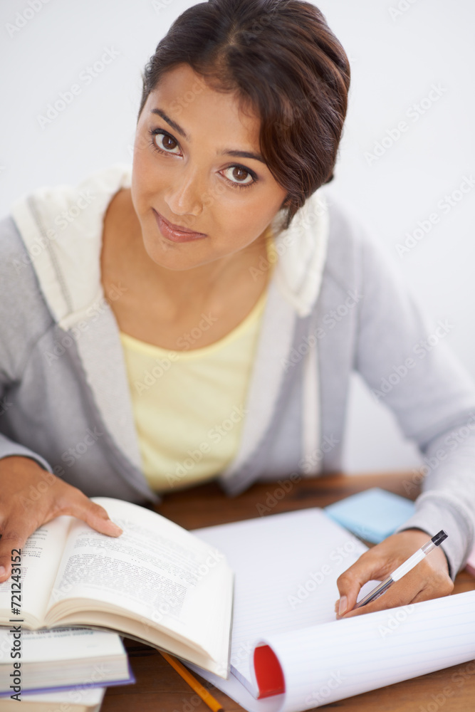 Portrait, writing and student studying in college, learning and reading for school project at desk. Face, books and woman at table for education, knowledge and info for notes in university in Brazil Portrait, writing and student studying in college, learning and reading for school project at desk. Face, books and woman at table for education, knowledge and info for notes in university in Brazil