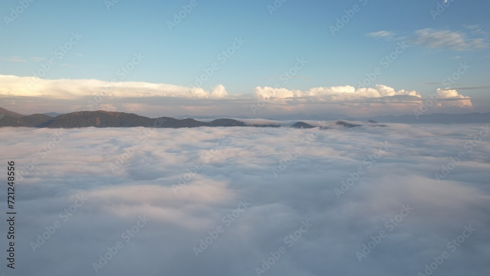 Flight above the clouds in the mountains of Georgia