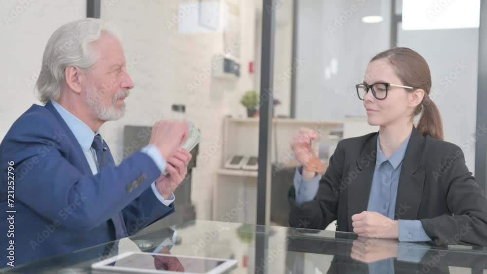 Old Businessman Giving Home Keys after getting Paid Old Businessman Giving Home Keys after getting Paid