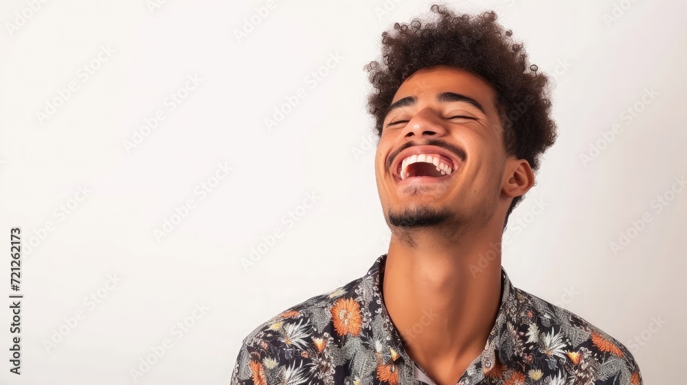 Fototapeta premium Young Brazilian man isolated on white background laughing