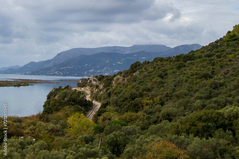 road between mountains and sea in albania in November, landscape with lake, lake in the mountains