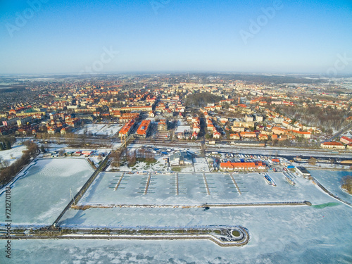 View of Gizycko town from the Niegocin lake in winter scenery, Mazury, Poland