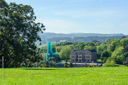 Historical Architecture Amidst Verdant Foliage in Comillas photo