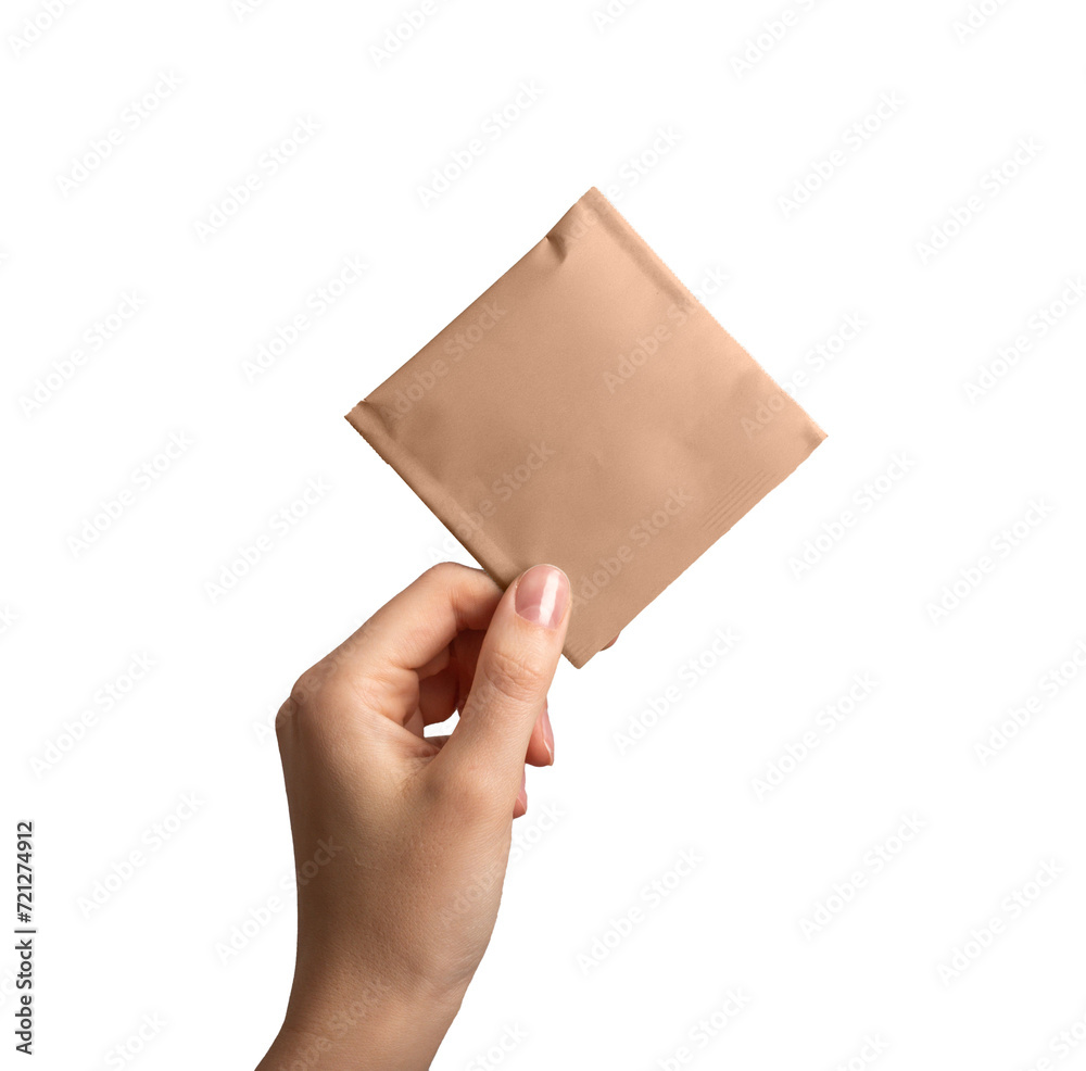 Kraft paper sachet, pouch package mockup. Tea bag mock up in hand, isolated on white