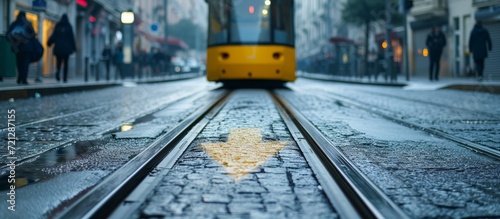 Arrow Sign on Road Surface Guides Tram on Tracks