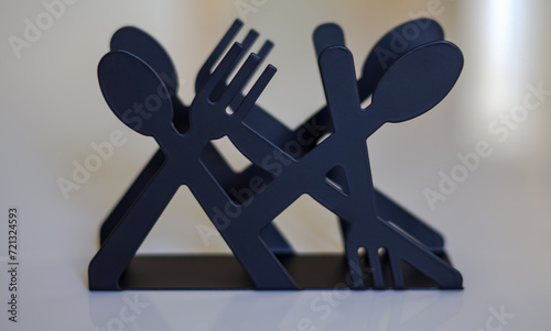 fork and spoon on blue
