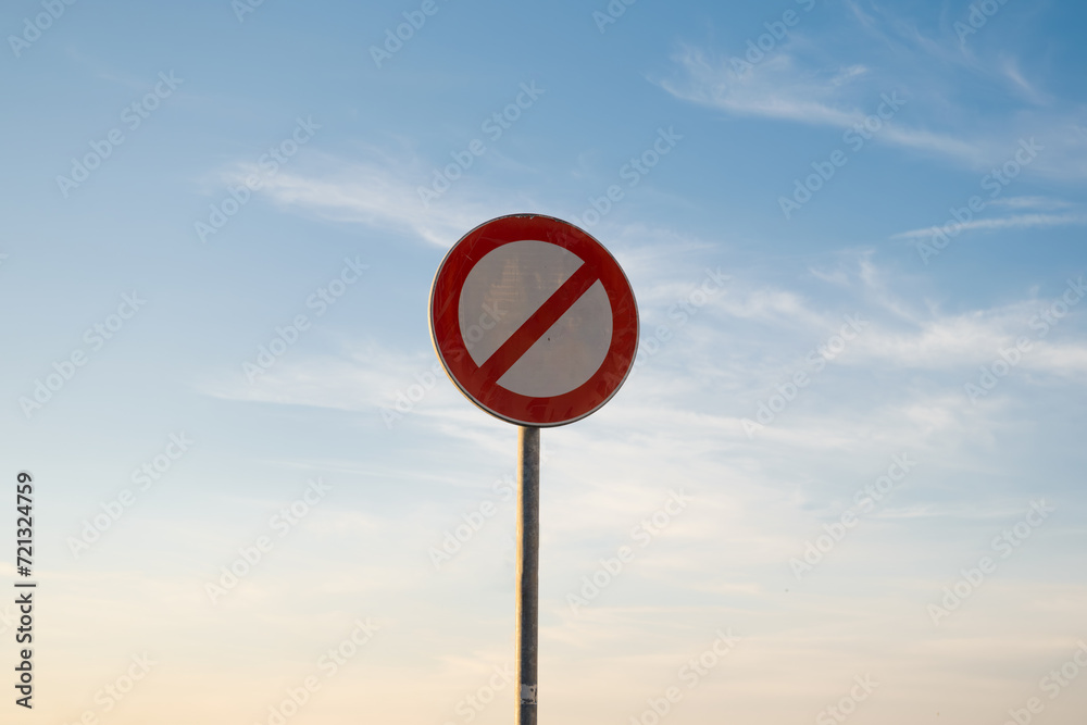 No entry right cross traffic sign, isolated sunset sky. No entry right cross traffic sign, isolated sunset sky.