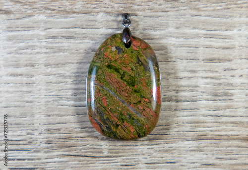 A close-up with an unakite stone pendant photo