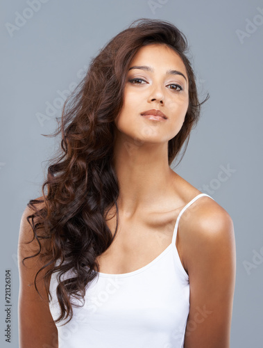 Hair care  woman and portrait or beauty in studio with keratin treatment  soft texture and shampoo shine. Model  Indian person and face with hairstyle  cosmetics and collagen glow on white background
