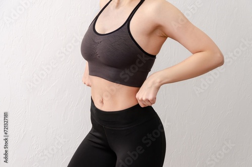 Young girl in sportswear on white background. Yoga clothes. 