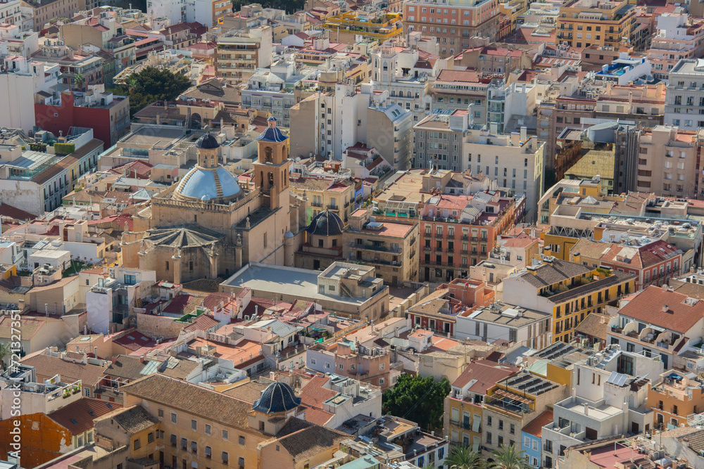 View over the historic city center of Alicante, Spain with blue domed Co-cathedral of Saint Nicholas of Bari and closely located buildings