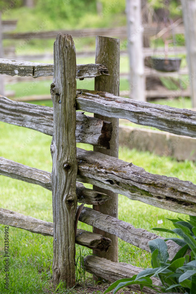 A rustic wooden fence in an Ontario countryside.