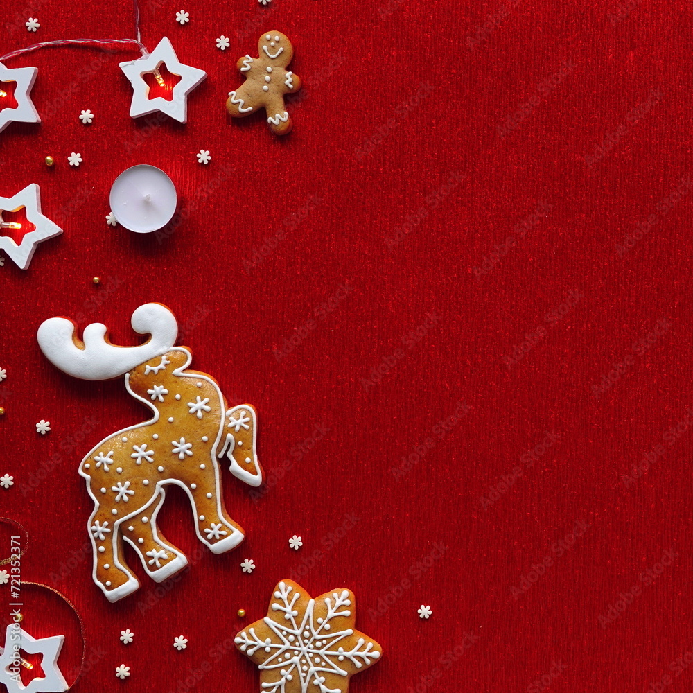 Festive Gingerbread Cookies and White Decorations on a Red Background for Christmas