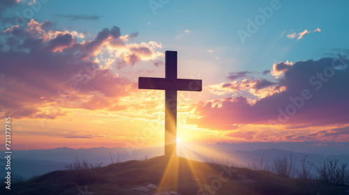 Cross silhouette against a radiant sunrise, symbolizing the spiritual significance of the Christian faith. © Nelson