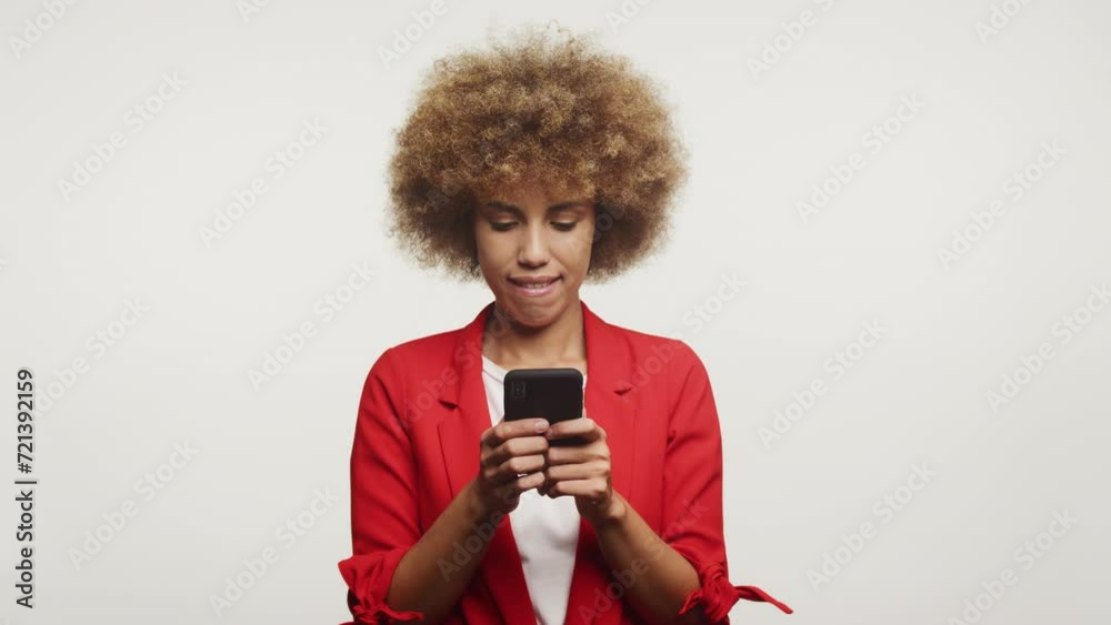 Businesswoman Using Smartphone with Focused Expression Businesswoman Using Smartphone with Focused Expression