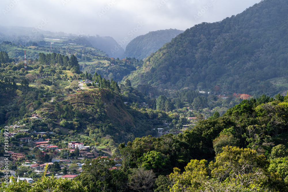 Distant landscape shot of Boquete jungle canyon with houses and forest