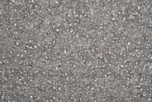 Styrofoam board, close-up of granules, backlit.