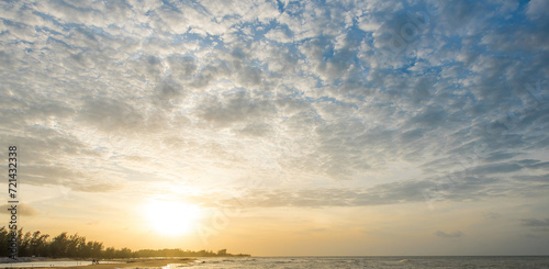 The colorful sky at sunsetin the sea look amazing. Nature beautiful Light Sunset or sunrise over sea.Real amazing panoramic sunrise or sunset sky with gentle colorful clouds. photo