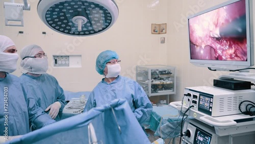 Video endoscopic surgery. A surgeon performs an operation to remove the gallbladder in the clinic. photo