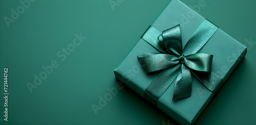 Banner with green gift box for man and boy, perfect for holiday or birthday gift, isolated on green background.