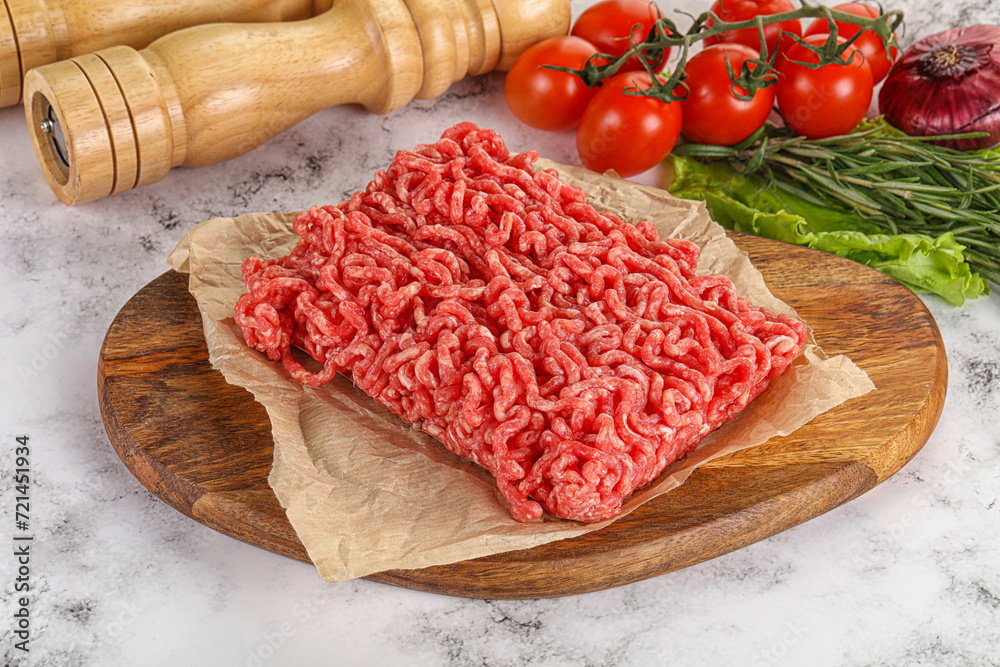Raw minced beef meat on cutting board Raw minced beef meat on cutting board