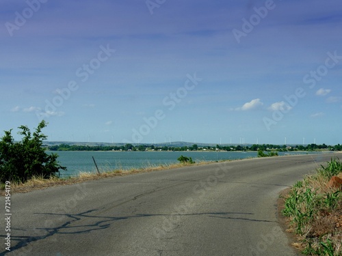 Paved road curbing along Lake Lawtonka ,  in Comanche County, Oklahoma. photo