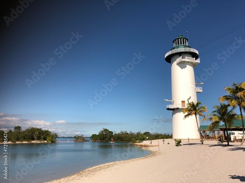 Lighthouse by the lagoon at Harvest Cay in Belize, Caribbean Islands. #721454765