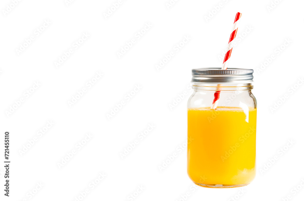 A Glass jar of orange juice with a multi-colored tube. Fresh orange juice A Glass jar of orange juice with a multi-colored tube. Fresh orange juice