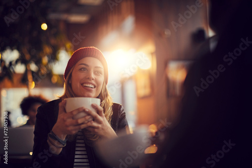 Happy woman eating dessert in a cafe photo