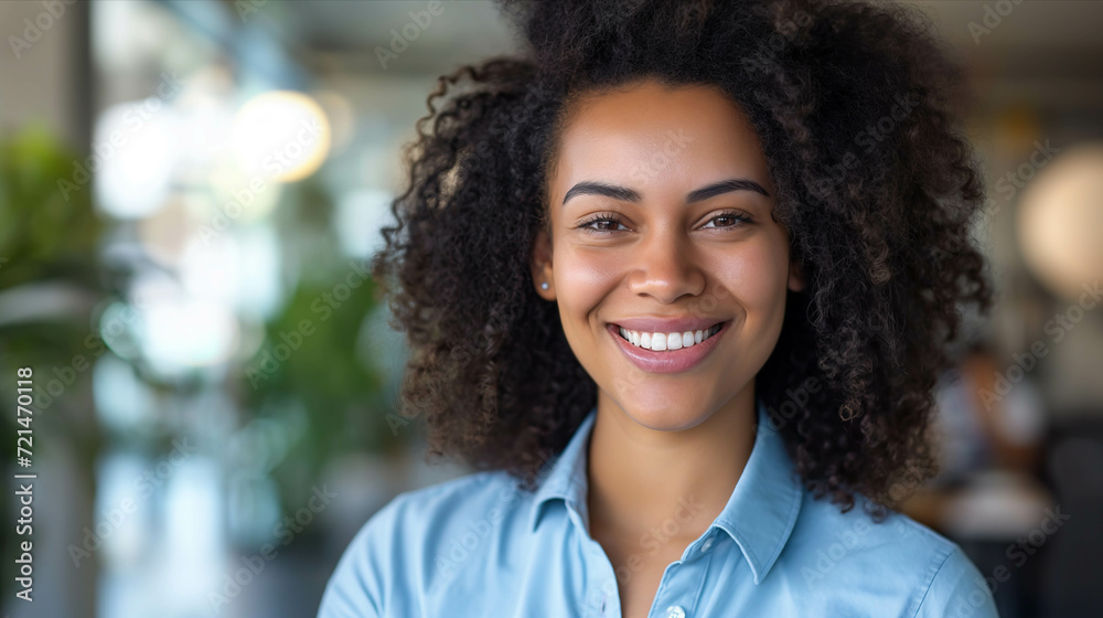 Young woman smiles with confidence in the office. Young woman smiles with confidence in the office.