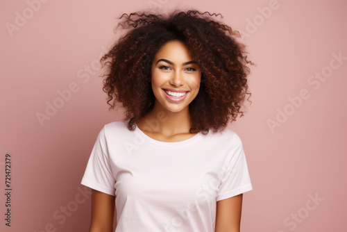 Young woman wearing white t-shirt mockup isolated on pink background.