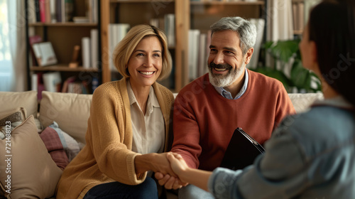 Smiling couple engaging with another person