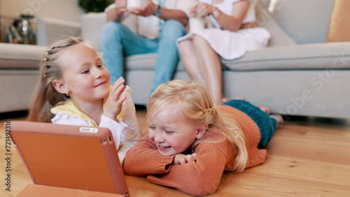 Children, tablet and sisters on a floor with games, fun and bonding while streaming at home together. Happy family, kids and siblings in a living room with digital, app or online cartoon in a house photo