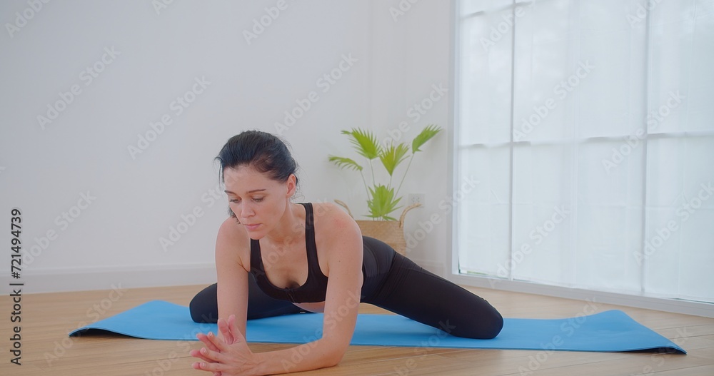 pretty young woman do meditation practice yoga for peace doing stretching exercise, fitness or spiritual health. Balance, mindfulness and wellness and relax at home, breathing and mindset training