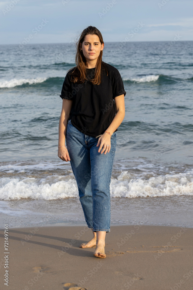 Girl wearing black t-shirt on the beach