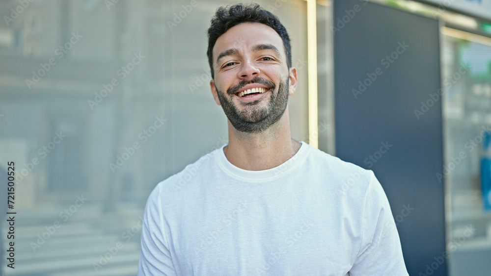 Young hispanic man smiling confident standing at street Young hispanic man smiling confident standing at street