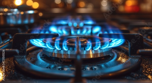 The fiery blue glow of the gas stove sets the kitchen ablaze, beckoning for a warm meal to be cooked on its inviting surface
