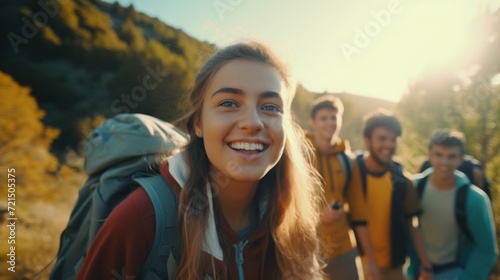 A group of people walking on a trail with backpacks. Ideal for outdoor activities and adventure themes