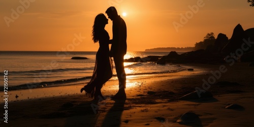 A passionate moment captured as a man and woman share a loving kiss on the beach at sunset. Perfect for romantic themes and relationship concepts