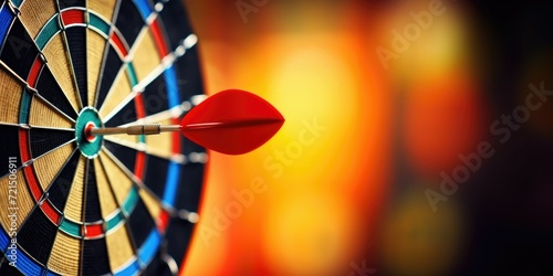 A dart hitting the center of a dartboard. Ideal for illustrating precision, accuracy, or hitting targets in business or sports