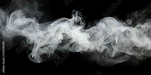 Close up shot of smoke on a black background. Perfect for creating a mysterious or dramatic atmosphere. Ideal for use in design projects, presentations, and advertisements