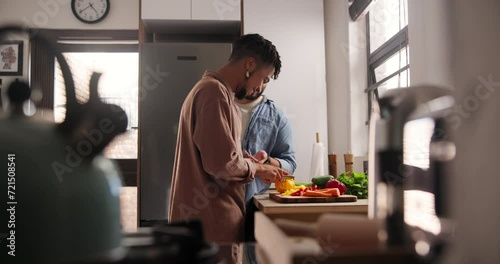 Man, gay couple and cutting vegetables for food, cooking or preparing meal together in kitchen at home. Young male person, lovers or LGBTQ relationship making healthy snack for nutrition at house photo