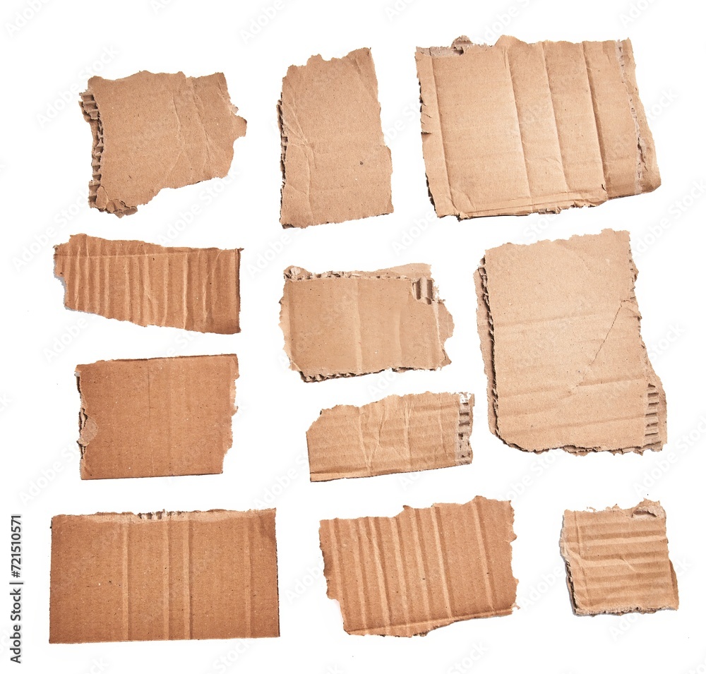  Ripped pieces of cardboard material over isolated white background