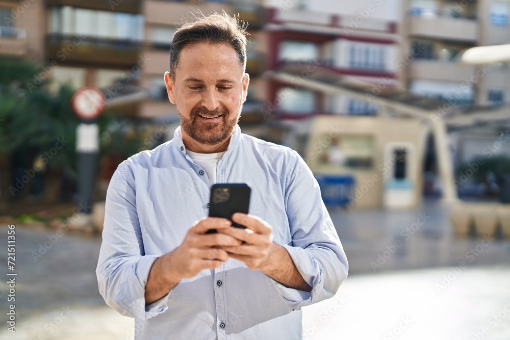 Young caucasian man smiling confident using smartphone at street Young caucasian man smiling confident using smartphone at street