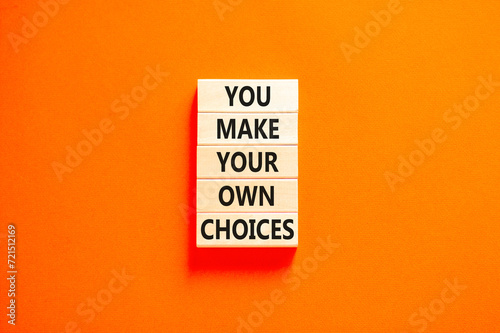 You make your own choice symbol. Concept words You make your own choice on wooden blocks. Beautiful orange table orange background. Business you make your own choice concept. Copy space.
